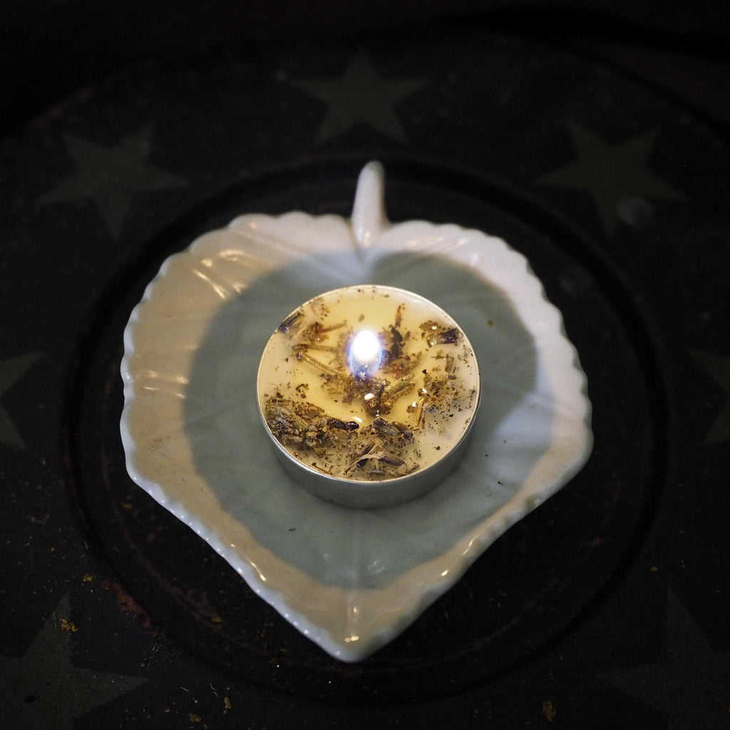 Cleansing ritual candle for energy purification.